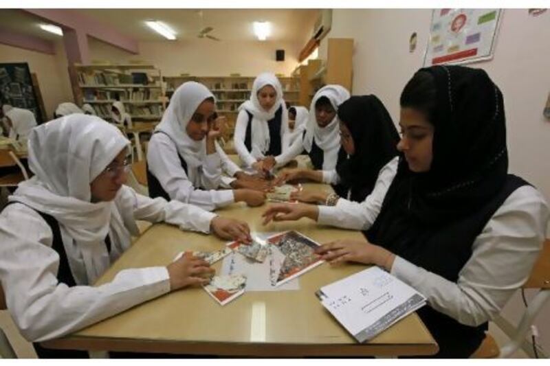 Grade 9 students solve picture puzzles as part of the activities in the anti-smoking campaign at Umm Suqeim school. Jeffrey E Biteng / The National