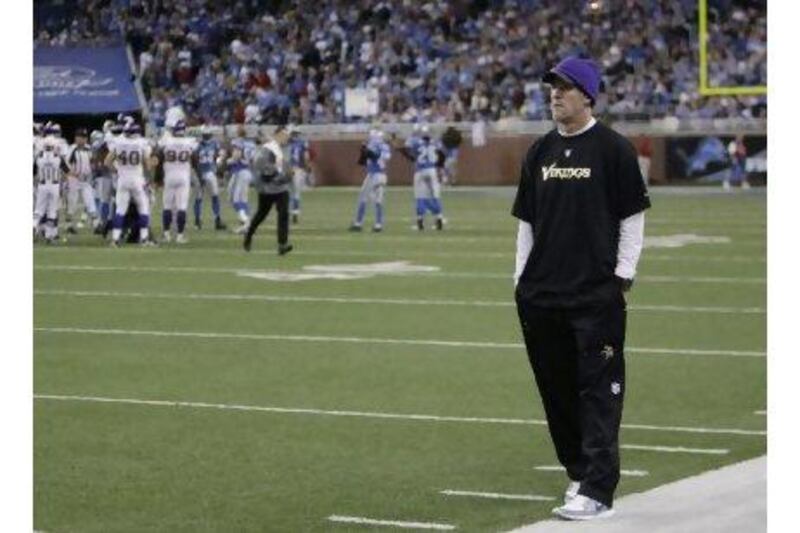 A pensive Brett Favre watches from the sidelines as Minnesota go down to the Detroit Lions.