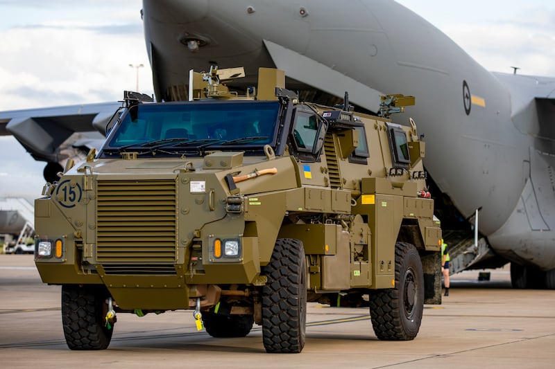 A Bushmaster protected mobility vehicle bound for Ukraine waits to be loaded onto a C-17A Globemaster III aircraft at RAAF Base Amberley, Australia. AP