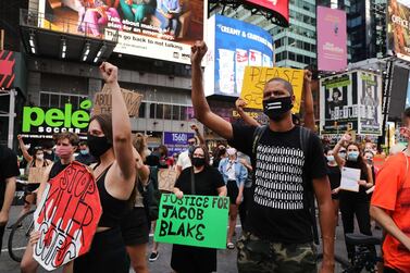 Protesters with the Black Lives Matter march through Manhattan, New York to protest against the police shooting of Jacob Blake in Kenosha, Wisconsin. Getty Images / AFP