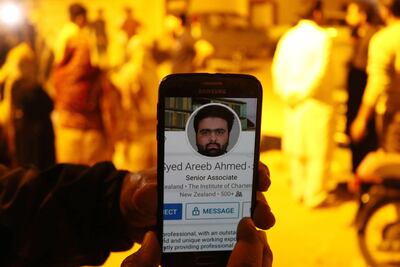 epaselect epa07442893 A man browse the Facebook profile of Syed Areeb Ahmed, a Pakistani victim of mass shooting in Christchurch, at his hometown in Karachi, Pakistan, Pakistan, 16 March 2019. A gunman killed 49 worshippers at the Al Noor Masjid and Linwood Masjid in Christchurch, New Zealand on 15 March. The 28-year-old Australian suspect, Brenton Tarrant, appeared in court on 16 March and was charged with murder.  EPA/REHAN KHAN