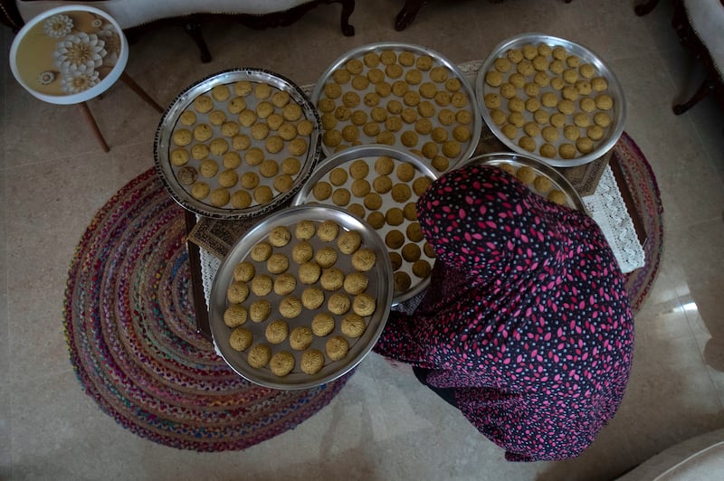 A Palestinian woman prepares sweets for Eid Al Adha in the West Bank city of Nablus.