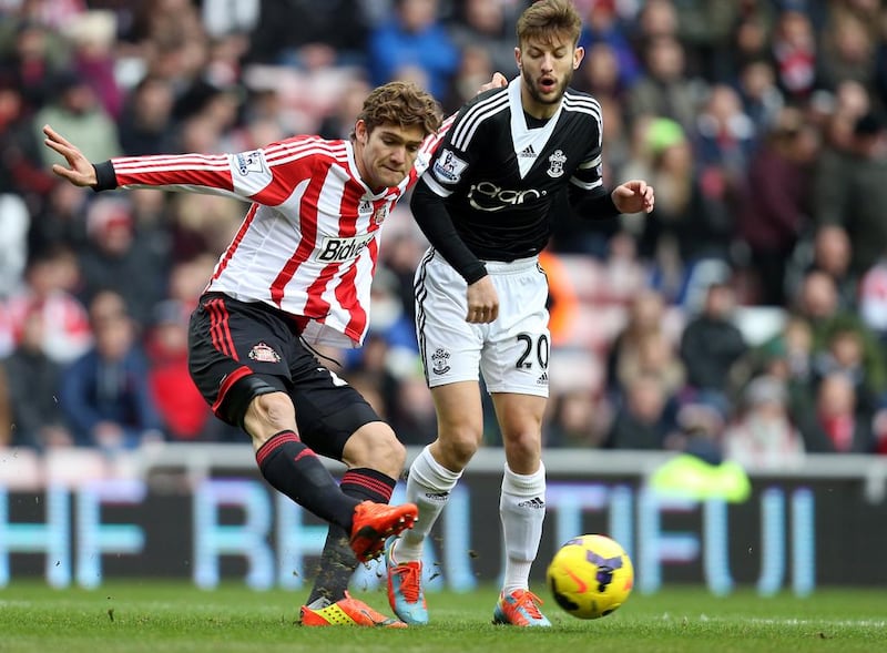 Sunderland's Marcos Alonso, left, vies for the ball with Southampton's Adam Lallana during their Premier League match at the Stadium of Light on Jan. 18. Scott Heppell / AP Photo