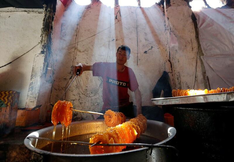 A man prepares special sweets at a small traditional factory on the first day of the holy month of Ramadan in Kabul, Afghanistan. Mohammad Ismail / Reuters