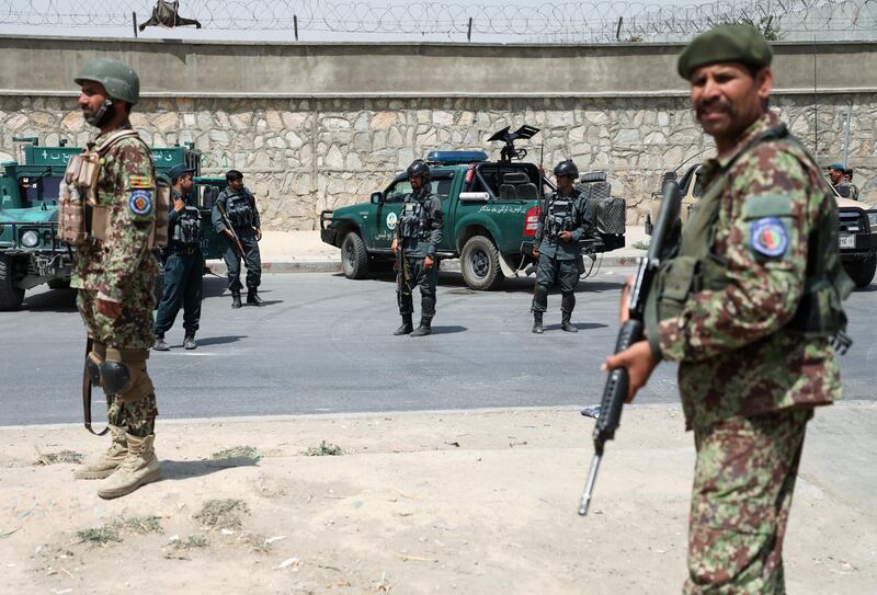 Members of Afghan security forces keep watch at the site of a car bomb blast in Kabul, Afghanistan, August 7, 2019. REUTERS/Omar Sobhani