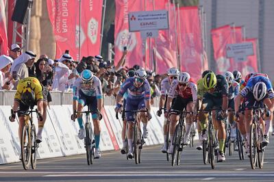 Team Visma-Lease a Bike's Dutch cyclist Olav Kooij, left, wins the fifth stage of the UAE Tour. AFP