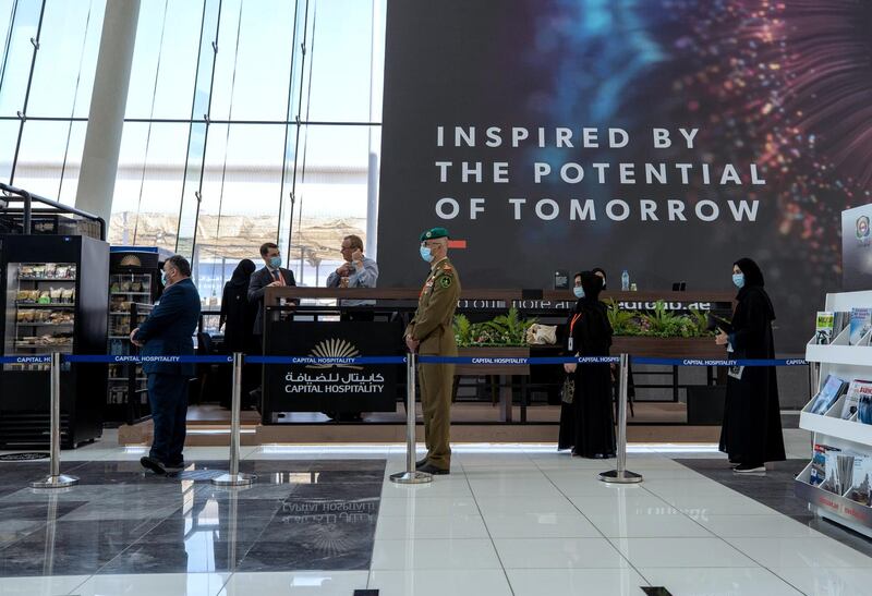 Abu Dhabi, United Arab Emirates, February 24, 2021.  Idex 2021 Day 4.
Exhbition visitors practice social distancing while lining up for coffee.
Victor Besa / The National
Section:  NA