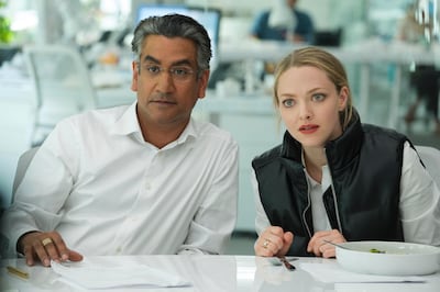 This image released by Hulu shows Naveen Andrews as Sunny Balwani, left, and Amanda Seyfried as Elizabeth Holmes in the Hulu series 'The Dropout', premiering March 3. Hulu via AP