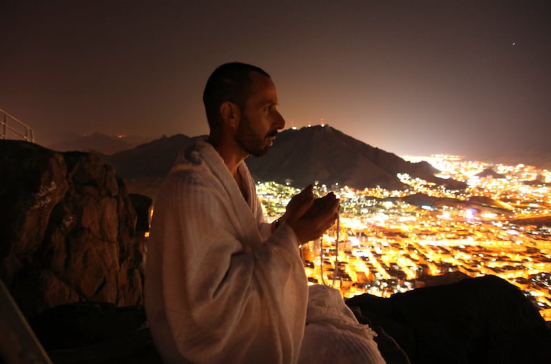 A pilgrim prays on top of Jabal Al Noor in Makkah in November 2010. Reuters