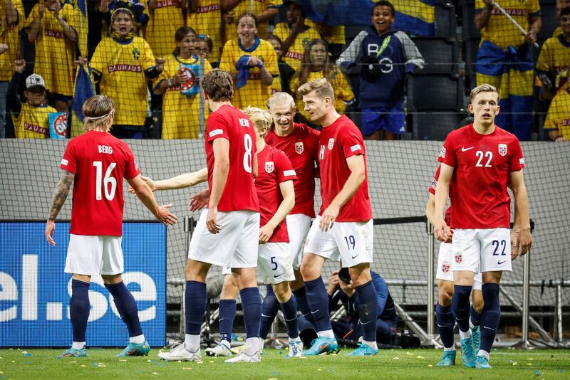 Erling Haaland celebrates with teammates after scoring Norway's second goal against Sweden. Reuters