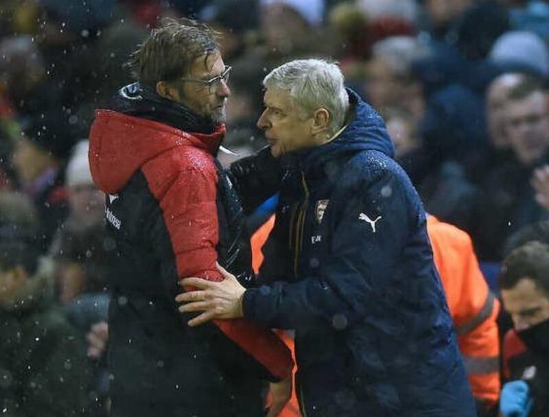 Jurgen Klopp, left has had a superior head to head against Arsene Wenger, right, ever since the German moved to Liverpool. Peter Powell / EPA