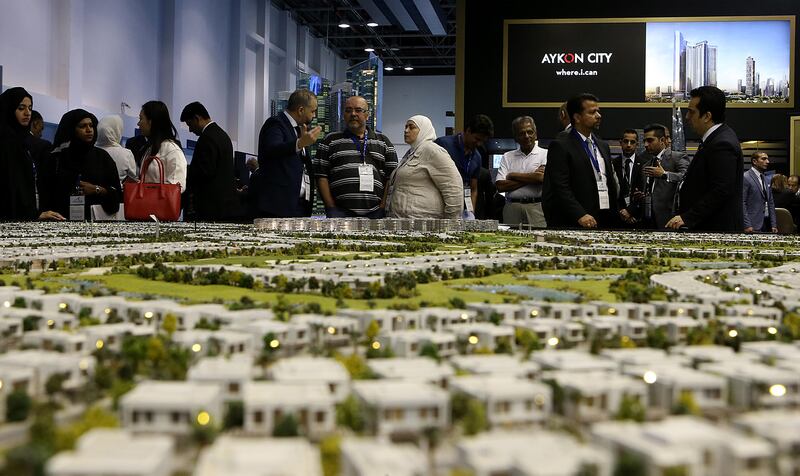 Dubai, 07, September, 2016 : Visitors take a closer look at the Projects by Damac Properties  at the Damac stand  at the Cityscape Global at the World Trade  centre in Dubai. ( Satish Kumar / The National )
ID No: 45021
Section: Business
Reporter: Michael Fahy *** Local Caption ***  SK-Cityscape-07092016-05.jpg