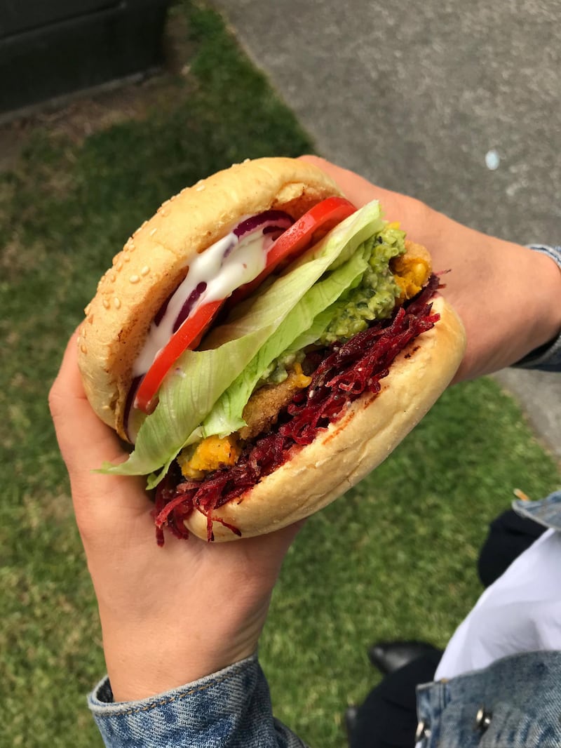 BurgerFuel’s V8 Vegan, featuring a patty made with pumpkin, carrot and chickpeas, is topped with vegan cheddar cheese, miso pea mash, vegan aioli and relish.