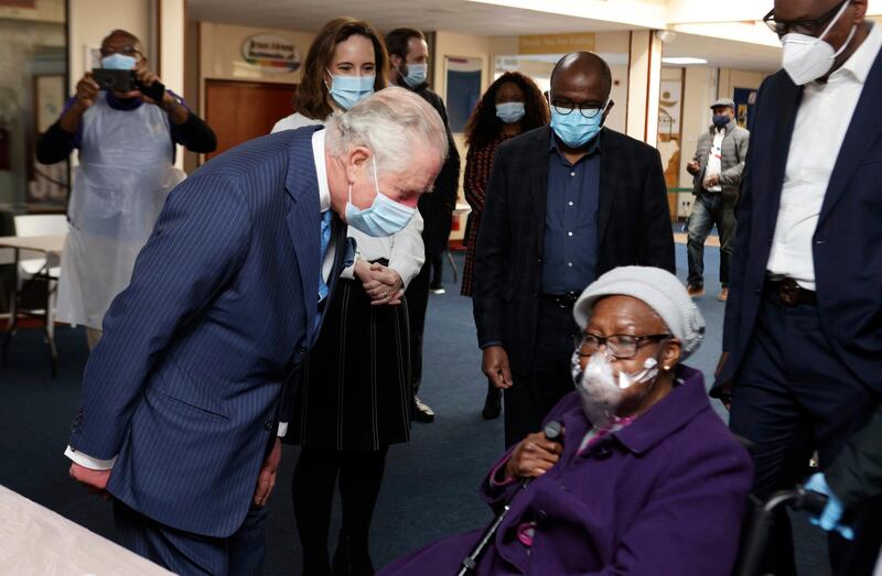 Prince Charles speaks with a member of the public during the visit. AP Photo