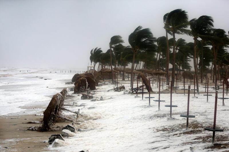 Debris and sea foam litters a beach during Cyclone Mekunu in Salalah, Oman, May 26, 2018. Cyclone Mekunu blew into the Arabian Peninsula early Saturday, drenching arid Oman and Yemen with rain, cutting off power lines, officials said. Kamran Jebreili / AP Photo