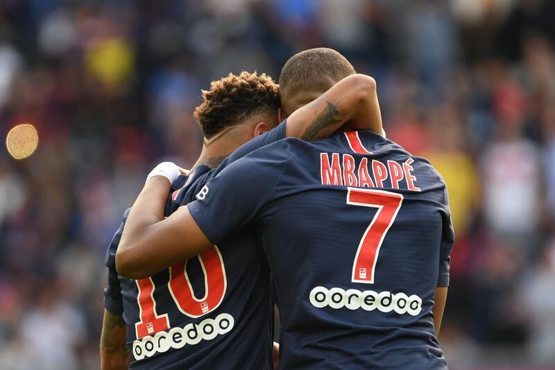 Mbappe is congratulated by Neymar. AFP