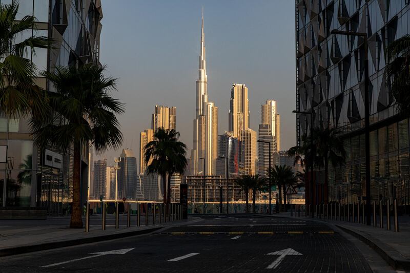 The Burj Khalifa stands beyond an empty road among other office buildings on the city skyline seen from Dubai Design District in Dubai. Bloomberg