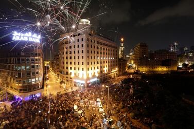 Anti-government protesters shout slogans in Beirut, Lebanon, Sunday, Oct. 20, 2019. Hundreds of thousands thronged public squares in the capital and across Lebanon on Sunday in the largest protests the country has seen since 2005, unifying an often divided public in revolt against traditional leaders who have ruled for three decades and brought the economy to the brink of disaster. (AP Photo/Hassan Ammar)