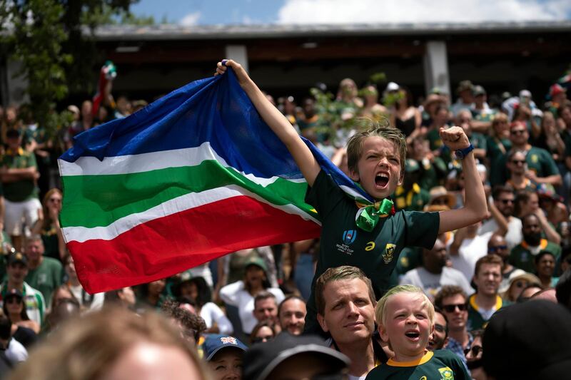 South African fans celebrate at the Pirates Rugby Club in Johannesburg, South Africa after their team's victory in the Rugby World Cup final between South Africa and England being played in Tokyo, Japan.  South Africa defeated England 32-12. AP Photo