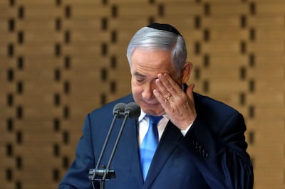 Israeli Prime Minister Benjamin Netanyahu delivers a speech at the state memorial ceremony for the fallen soldiers of the 1973 Yom Kippur War, at the Hall of Remembrance on Mt. Herzl in Jerusalem on October 10, 2019. / AFP / GALI TIBBON
