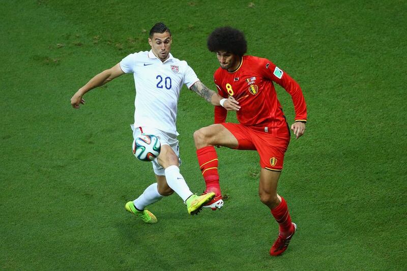 Geoff Cameron of the United States challenges Marouane Fellaini of Belgium during their match on Tuesday at the 2014 World Cup in Salvador, Brazil. Robert Cianflone / Getty Images