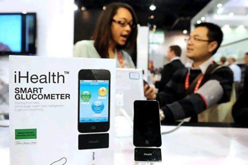 The amount spent on health care in the UAE is forecast to grow 8.6 per cent this year. Above, health products on display at the International Consumer Electronics Show in Las Vegas. Frederic Brown / AFP