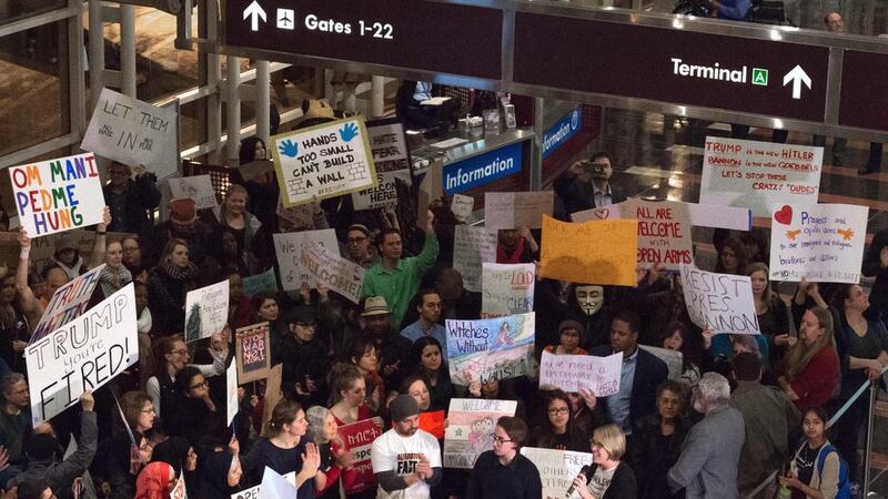 A protest against Donald Trump’s immigration ban at Ronald Reagan National Airport in Virginia. The new US president’s policies have been protectionist and isolationist in nature, not deregulatory as business analysts had hoped. Paul Richards / AFP
