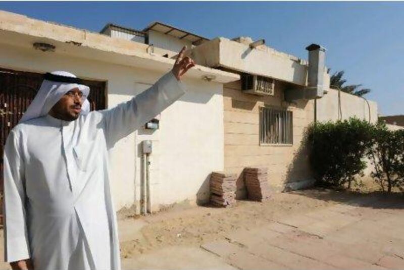 Abdullah Mohammed, a retired Arabic teacher, stands in front of his house in Ahmadi yesterday. He says residents are “nervous because this situation is very dangerous”.