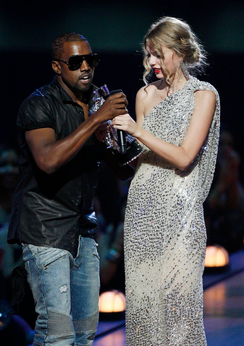 West takes the mic from singer Taylor Swift as she accepts an MTV Video Music Award 2009. He said Beyonce should have won instead. AP Photo