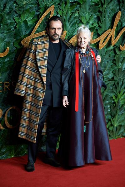 epa07222515 British fashion designer Vivienne Westwood (R) and her husband Andreas Kronthaler (L) arrive for The Fashion Awards in London, Britain, 10 December 2018. The Fashion Awards is showcasing both British and international individuals and businesses who have made the most outstanding contributions to the fashion industry.  EPA/Niklas Halle'n