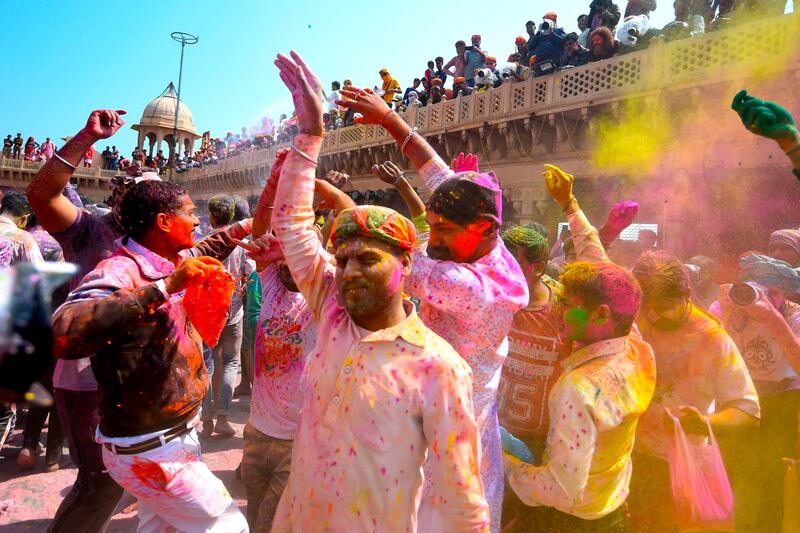 Hindu devotees celebrate Holi, the spring festival of colours, during a traditional gathering at a temple in Nandgaon village in Uttar Pradesh state on March 5, 2020. Holi is observed in India at the end of the winter season on the last full moon of the lunar month. AFP