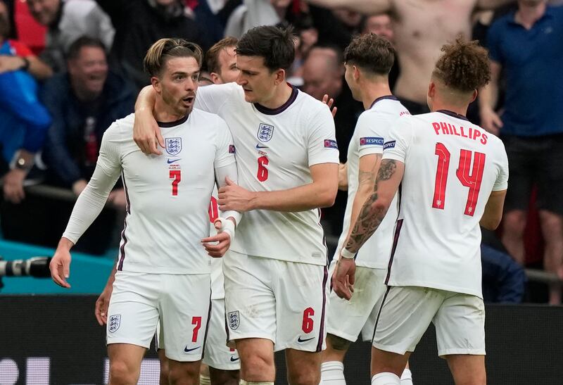 Substitute Jack Grealish, left, is congratulated after setting up England's second goal. Reuters