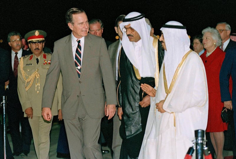 George HW Bush, US president at the time, is greeted by King Fahd as he arrives in Saudi Arabia on November 21, 1990. AP