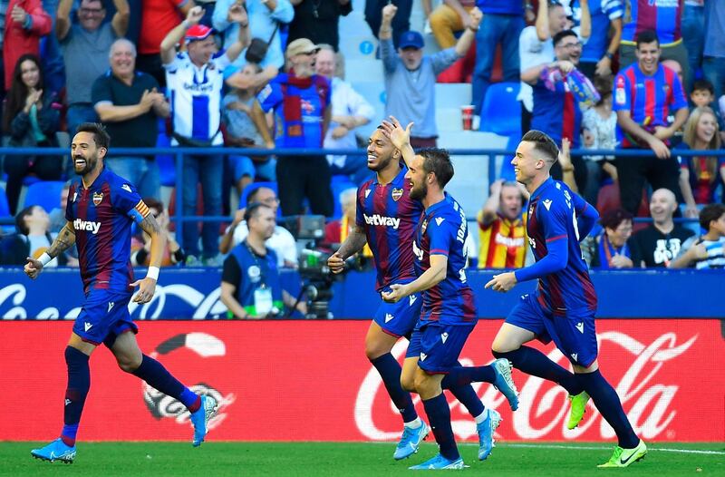 Levante's players celebrate their third goal scored against Barcelona at the Ciutat de Valencia Stadium. AFP