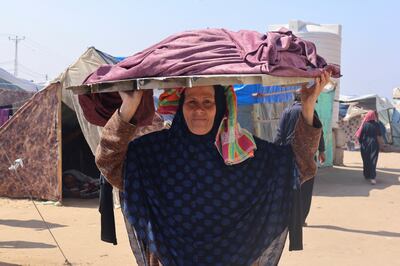 A displaced Palestinian woman living in a tent camp in Rafah, southern Gaza. Reuters