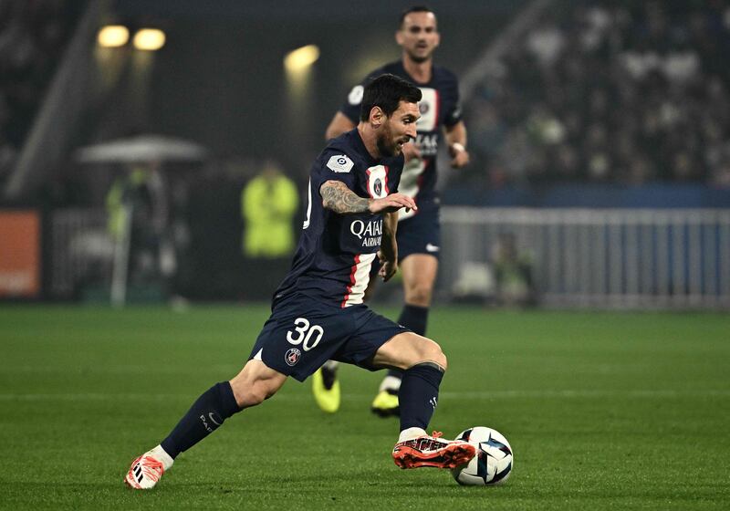 Paris Saint-Germain's Lionel Messi dribbles with the ball. AFP
