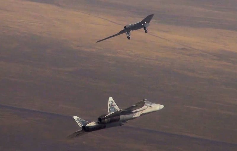 The first joint flight of a Sukhoi S-70 Okhotnik heavy unmanned combat aerial vehicle and a Sukhoi Su-57 jet fighter. As part of a testing programme, Okhotnik has performed a fully unmanned flight into an airborne alert area. Photo: Russian Defence Ministry / Tass