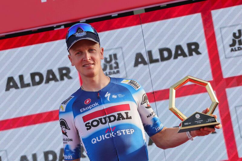 Soudal Quick–Step's Belgian rider Tim Merlier with the trophy after winning Stage 6 of the UAE Tour from the Louvre Abu Dhabi to Abu Dhabi Breakwater on February 24, 2024. AFP