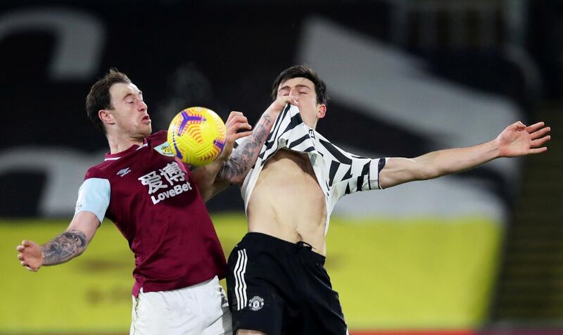 Burnley's Ashley Barnes in action with Manchester United's Harry Maguire. Reuters