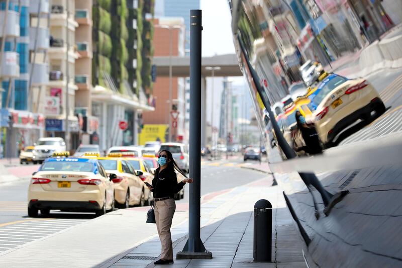 Dubai, United Arab Emirates - Reporter: N/A. News. Covid-19/Coronavirus. A lady wears a protective face mask as she waits outside Sharaf DG metro station. Friday, July 3rd, 2020. Dubai. Chris Whiteoak / The National