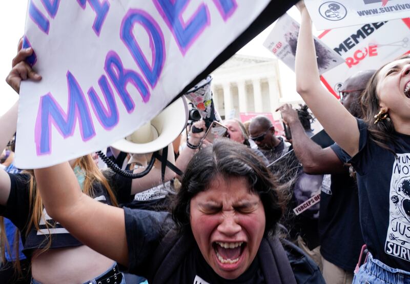 People celebrate outside the Supreme Court after the conservative majority overturned Roe v Wade. AP