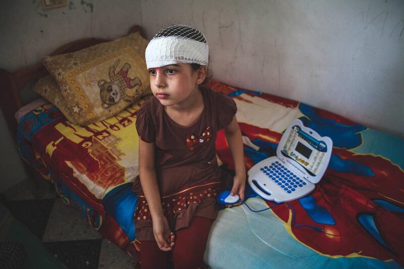 Bisan Daher, 8, lost her parents and four brothers and sisters when an Israeli F16 jet bombed their home during the summer 50-day war on Gaza. As her physical injuries begin to heal, the psychological damage is starting to emerge. Andrea DiCenzo for The National