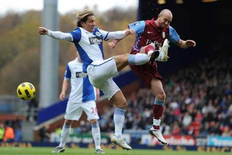 Aston Villa's Stephen Ireland, right, and Blackburn Rovers' Michel Salgado battle for the ball.