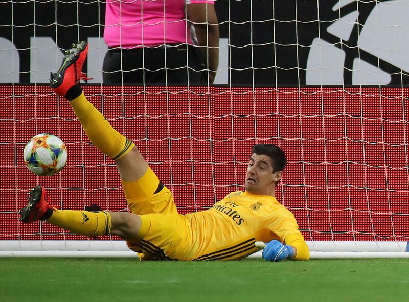 Real keeper Thibaut Courtois makes a save. Reuters