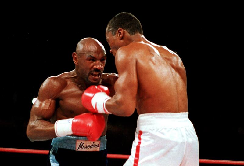 In this April 1987 file photo, "Marvelous" Marvin Hagler, left, moves in on "Sugar" Ray Leonard during the third round of a boxing bout in Las Vegas. Leonard won with a split decision. Hagler, the middleweight boxing great whose title reign and career ended with the loss to Leonard in 1987, died Saturday, March 13, 2021. He was 66. AP