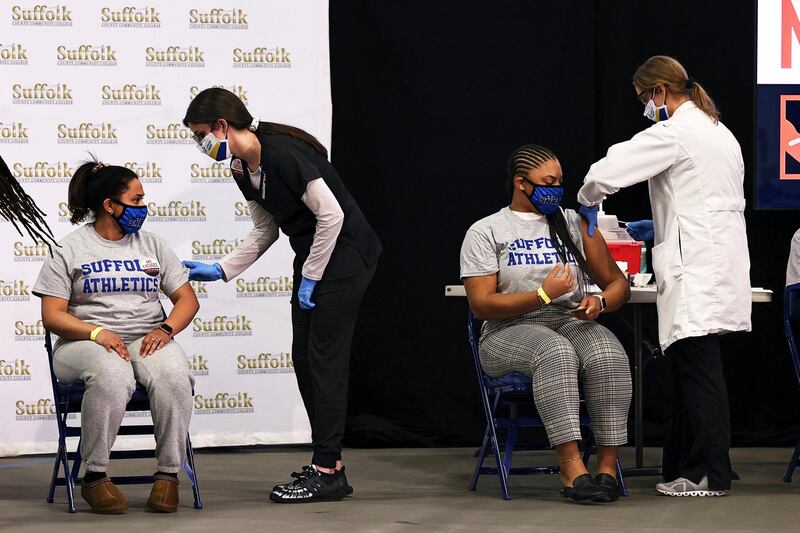 Students from Suffolk County Community College prepare to get vaccinated during a news conference at the school in Brentwood, New York. Several colleges in the state announced the cancellation of vaccination clinics using the Johnson & Johnson vaccine. AP Photo