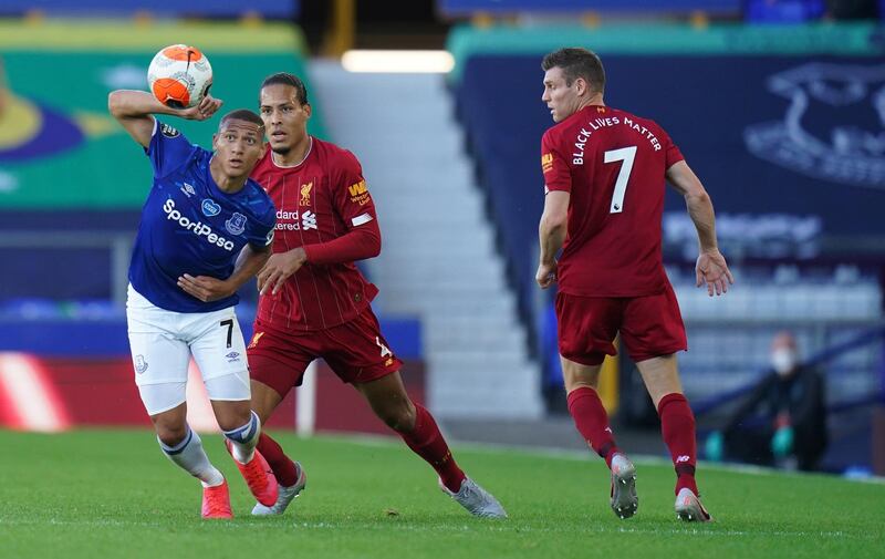 epa08501037 Everton's Richarlison (L) in action against Liverpool's  Virgil van Dijk (C) during  the English Premier League soccer match between Everton FC and Liverpool FC in Liverpool, Britain, 21 June 2020.  EPA/JON SUPER/ NMC / AP POOL EDITORIAL USE ONLY. No use with unauthorized audio, video, data, fixture lists, club/league logos or 'live' services. Online in-match use limited to 120 images, no video emulation. No use in betting, games or single club/league/player publications.