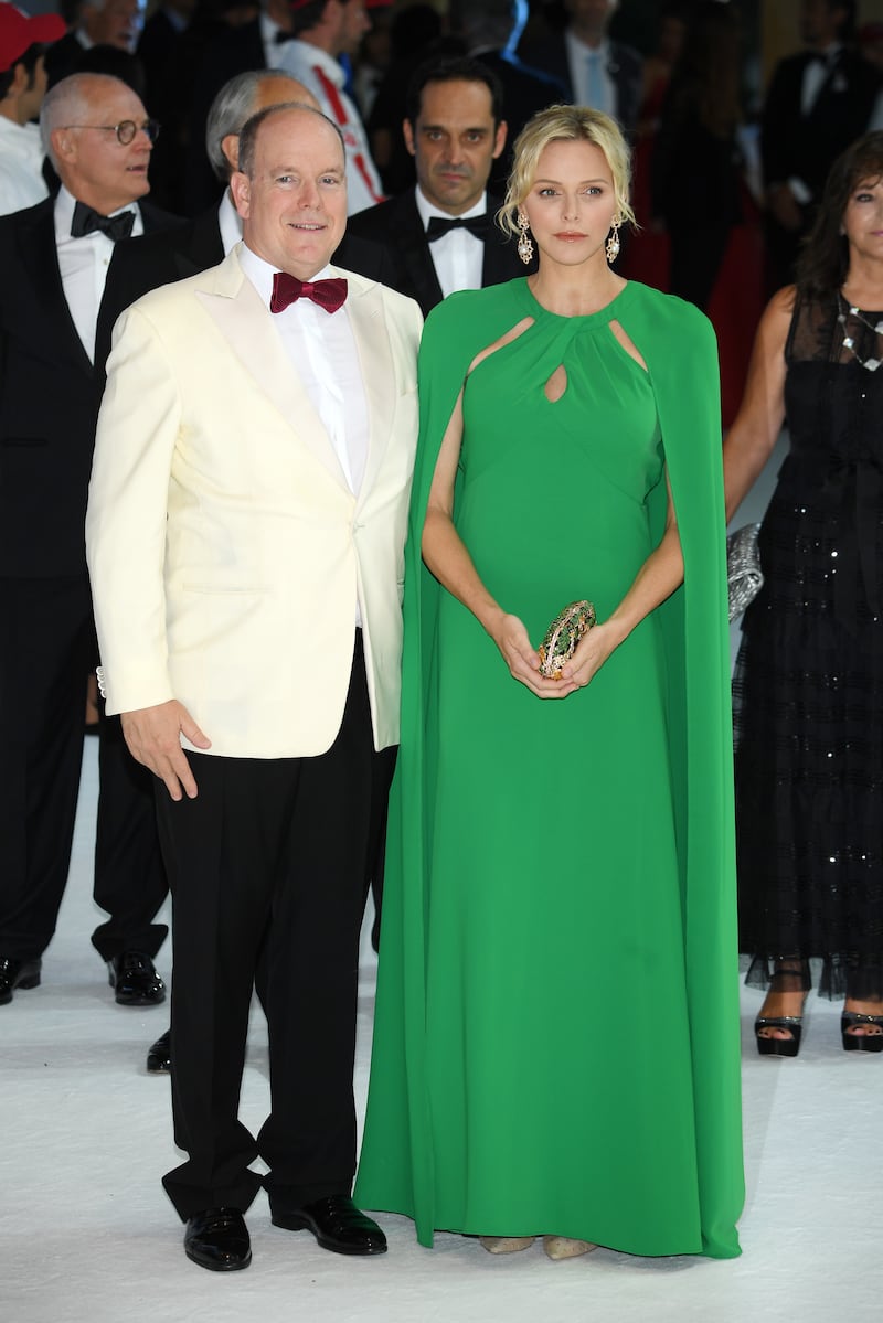 Prince Albert II of Monaco and Princess Charlene, in a green caped gown, attend the 71th Monaco Red Cross Ball Gala on July 26, 2019. Getty Images