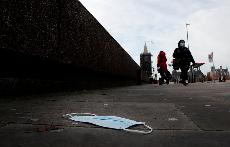 A mask on the pavement near the entrance of a hospital on Westminster Bridge in London. AP Photo