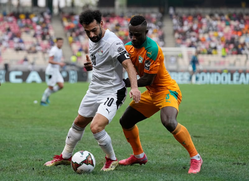 Egypt captain Mohamed Salah under pressure from Ivory Coast's Ghislain Konan. AP